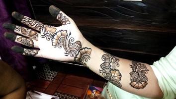 Popular Mehndi Designs for Hands or Hands painted with Mehandi Indian traditions photo