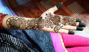 Popular Mehndi Designs for Hands or Hands painted with Mehandi Indian traditions photo