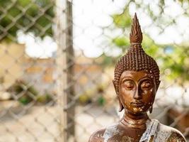 The Buddha image, photographed in the upper part, is revered in the Buddhist religion. There are stains from various ceremonies. according to the faith of the people photo