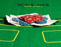 Poker chips and bills at a poker table. Horizontal image. photo