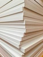 A stack of wooden boards for handicraft construction. photo