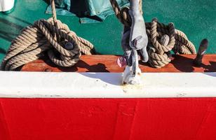 Detailed close up detail of ropes and cordage in the rigging of an old wooden vintage sailboat photo