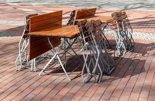 View at empty tables and chairs of a closed restaurant during the pandemic lockdown photo