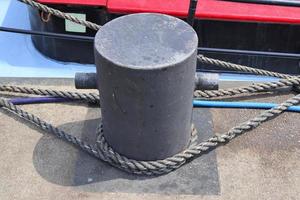 Different bollards and technical installations of vessel traffic at a port photo