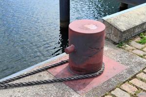 Different bollards and technical installations of vessel traffic at a port photo