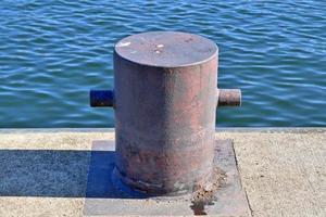 Different bollards and technical installations of vessel traffic at a port photo