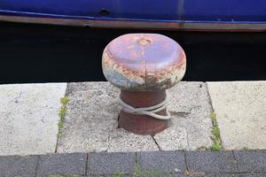 Different bollards and technical installations of vessel traffic at a port photo