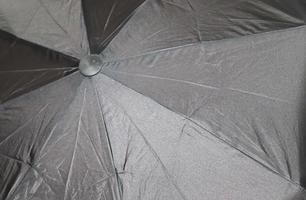 Close up view at the colorful surfaces of a rainproof umbrella photo