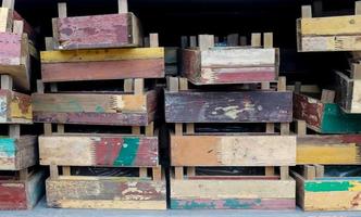 Vintage wooden crates in a shelf for sale in a small shop. photo