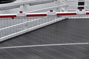 Different bollards and technical installations of vessel traffic at a port photo