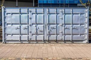 Detailed close up view on metal and steel surfaces on a silver cargo containter photo