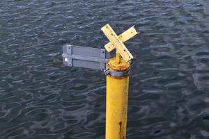 Different bollards and technical installations of vessel traffic at a port photo