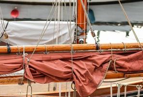 Detailed close up detail of ropes and cordage in the rigging of an old wooden vintage sailboat photo