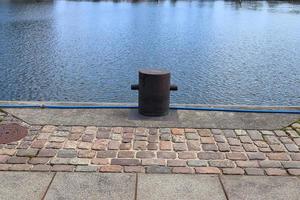 Different bollards and technical installations of vessel traffic at a port photo