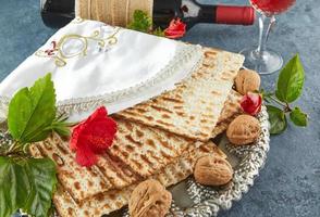 Pesach celebration concept - jewish Passover holiday. Matzah on traditional Seder plate photo