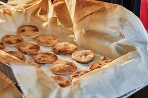 Dough circles are ready after baking in the oven for appetizer with ricotta cheese and cherry tomatoes photo
