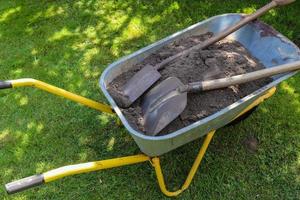 Gardening equipment on grass with empty space photo