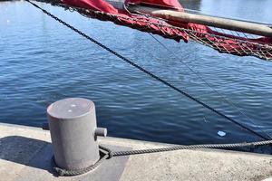 Different bollards and technical installations of vessel traffic at a port photo