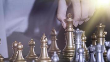 Concentrated serious boy developing chess gambit, strategy ,playing board game to winner clever concentration and thinking child while playing chess. Learning, tactics and analysis concept. photo