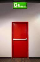 Fire exit door. Fire exit emergency door red color metal material photo