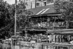 Black White Asian, Thailand slum zone with rooftop, electric pole, tree, garbage, satellite in picture photo
