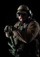 Armed soldier ready for battle. Military concept. photo