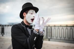 Mime on the street waiting to meet with his lover photo