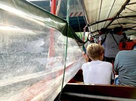 blonde boy in the canal boat photo