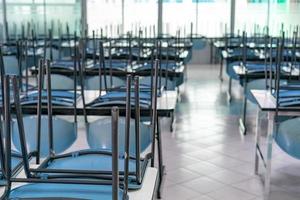 chair on the table in the closed canteen photo