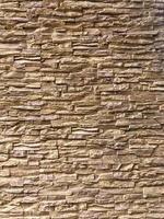 Classic Random Light brown brick arranged on the wall for decorate exterior of building. photo