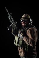 Armed soldier ready for battle. Military concept. photo