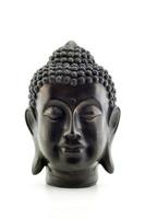 Portrait of a Buddha statue isolated on white background photo