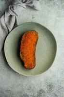 Wholegrain bread toasts with red trout caviar photo