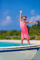 Adorable little girl on boat during summer vacation