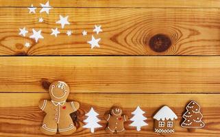 Christmas gingerbread cookies on wooden background photo