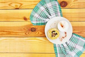 Tartlets with champignons on wooden background photo