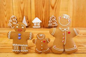 Christmas gingerbread cookies on wooden background photo
