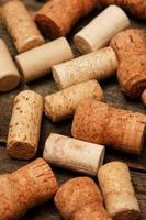 Wine corks on wooden background photo