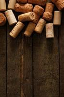 Wine corks on wooden background photo