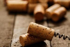 Corkscrew and wine corks photo