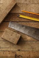 Carpentry tools on wooden surface photo