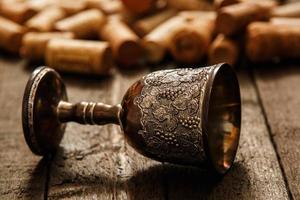 Medieval goblet and wine corks photo