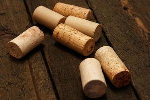 Wine corks on wooden background photo