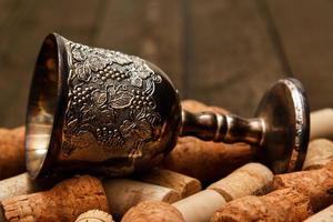 Medieval goblet and wine corks photo