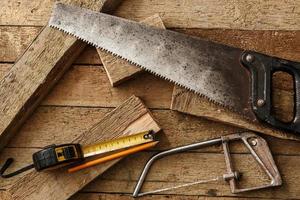 Carpentry tools on wooden surface photo