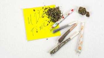 Joints with medical marijuana on white background. Cannabis weed and buds photo