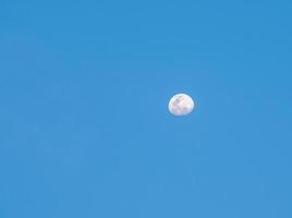 Full moon in the clear blue sky. photo