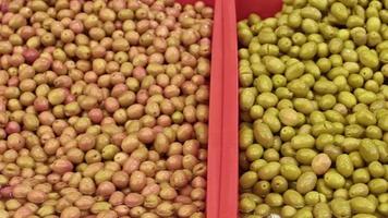 Fresh Olives in Saddles at the Market Footage. video