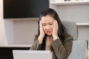 Unhealthy woman touch forehead suffers from migraine strong headache, woman massaging temples close up, suffering from strong head ache photo