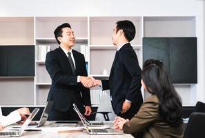Success and happiness teamwork concept, Businessman handshake finishing up a meeting business partnership after good deal photo